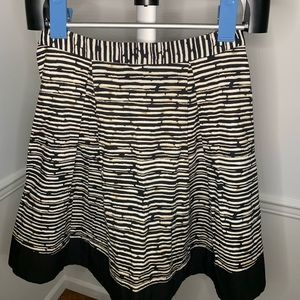 Vince Camuto cotton blend pleated and lined flare skirt with side zipper.